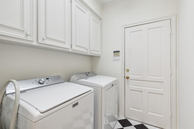 washroom with cabinets and independent washer and dryer