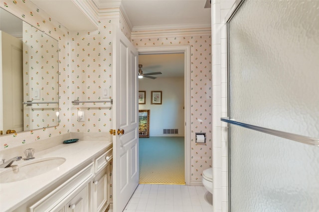 bathroom featuring walk in shower, tile patterned flooring, toilet, vanity, and ornamental molding