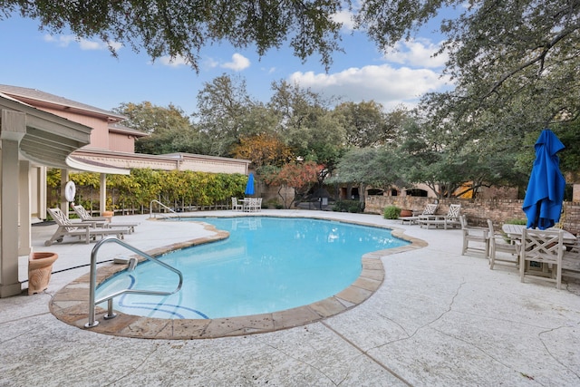 view of pool featuring a patio area