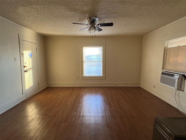 interior space with a textured ceiling, ceiling fan, cooling unit, and dark wood-type flooring