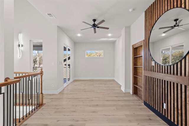 hall with light hardwood / wood-style flooring