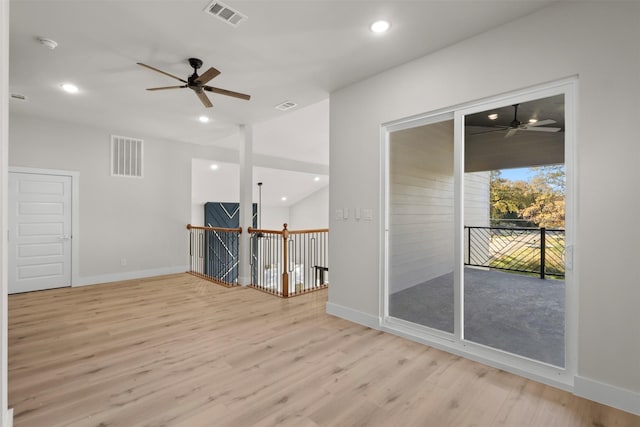 spare room featuring ceiling fan and light wood-type flooring