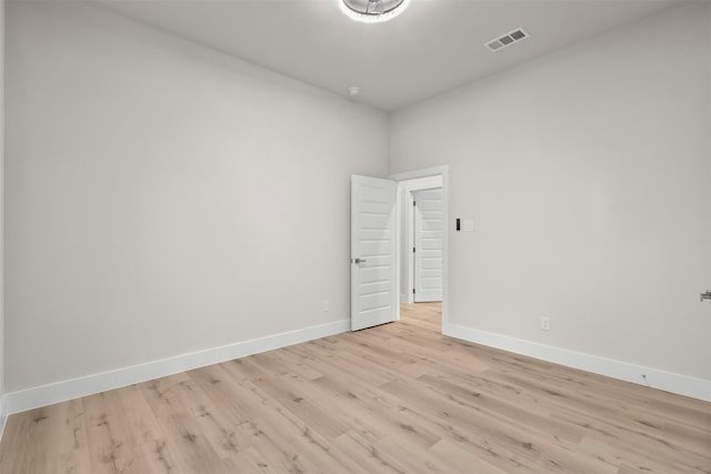 spare room with light wood-type flooring