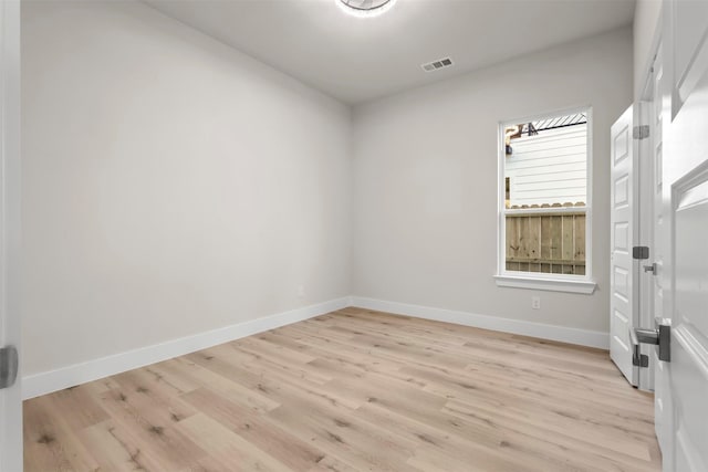 unfurnished room with light hardwood / wood-style flooring