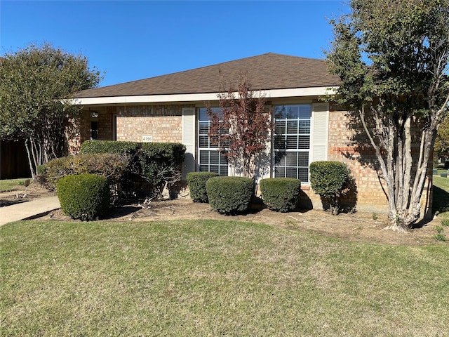 view of home's exterior with a yard