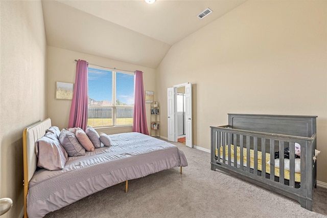 carpeted bedroom featuring vaulted ceiling