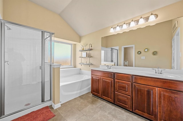 bathroom with tile patterned flooring, vaulted ceiling, separate shower and tub, and vanity