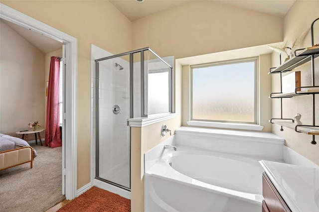 bathroom featuring vanity, plus walk in shower, and vaulted ceiling