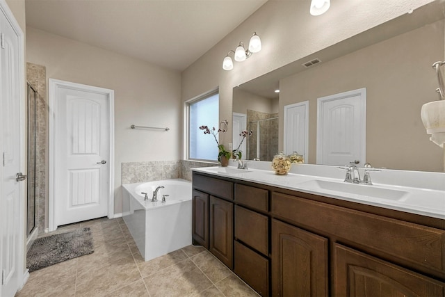 bathroom featuring vanity, tile patterned floors, and independent shower and bath