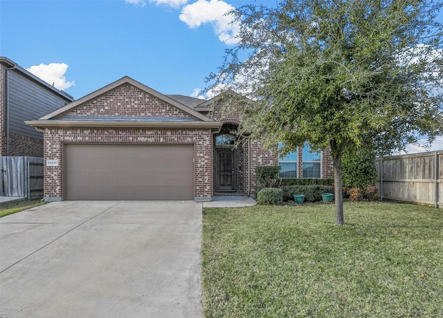 view of front of house featuring a garage and a front yard