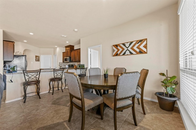 dining room with light tile patterned flooring