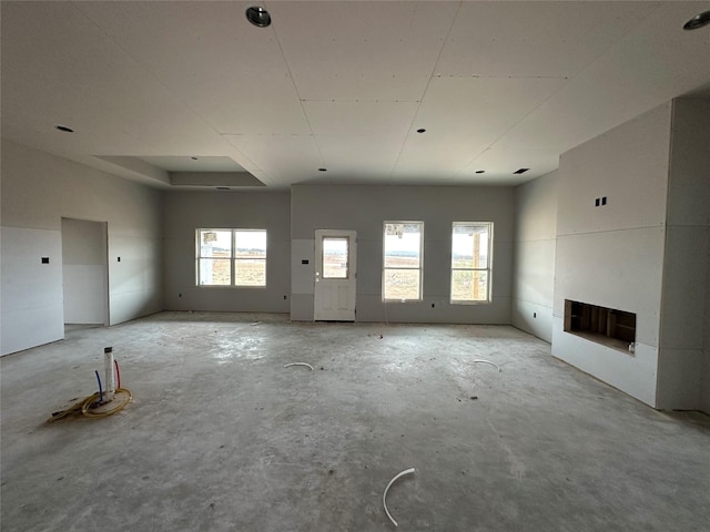 unfurnished living room with a fireplace