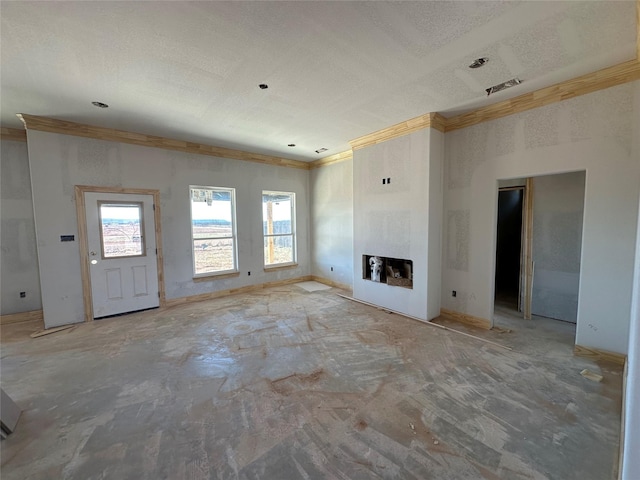 unfurnished living room with a textured ceiling, a fireplace, visible vents, baseboards, and crown molding