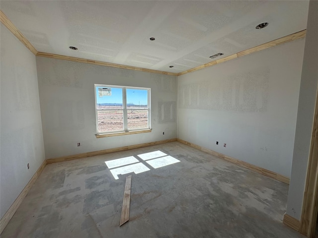 spare room featuring baseboards and visible vents