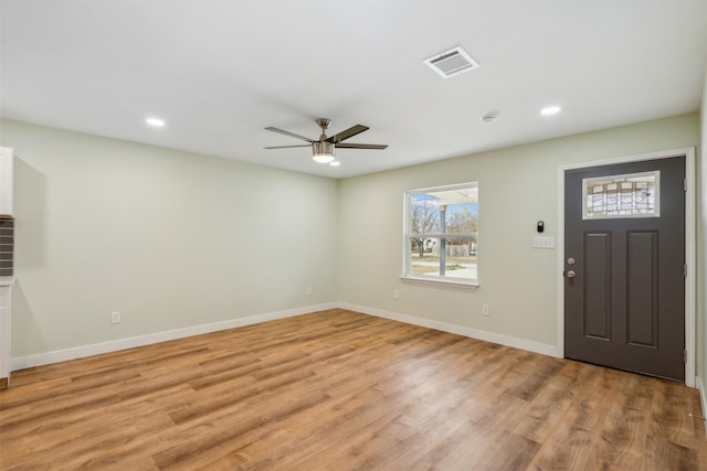 entrance foyer featuring light hardwood / wood-style flooring and ceiling fan