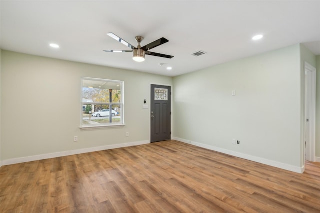 foyer featuring ceiling fan and light wood-type flooring