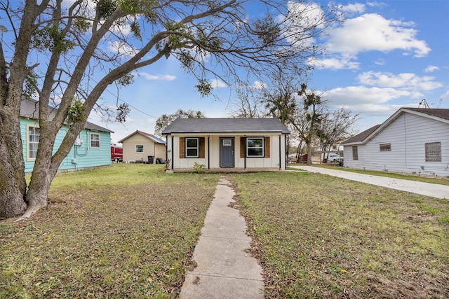 bungalow-style house with covered porch and a front lawn