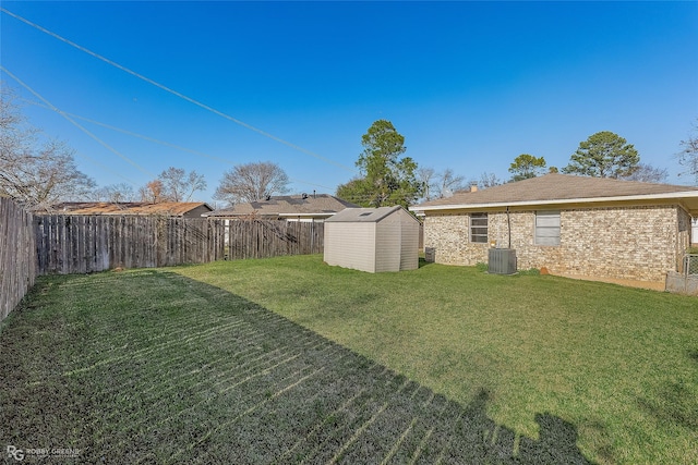 view of yard with a storage shed and central AC unit