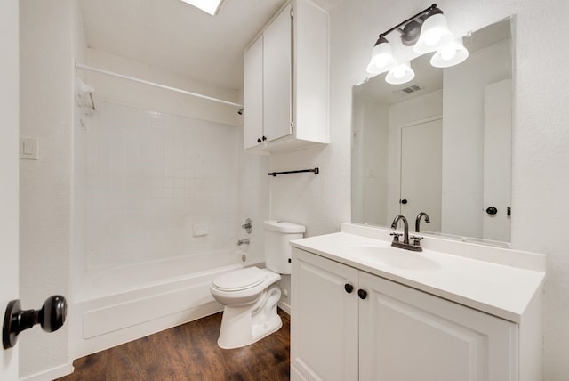 full bathroom featuring bathing tub / shower combination, toilet, vanity, and hardwood / wood-style flooring