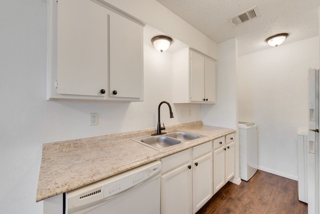 kitchen featuring a textured ceiling, white appliances, sink, dark hardwood / wood-style floors, and white cabinetry