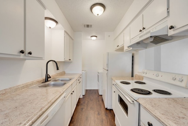 kitchen featuring white appliances, dark wood-type flooring, white cabinets, sink, and a textured ceiling