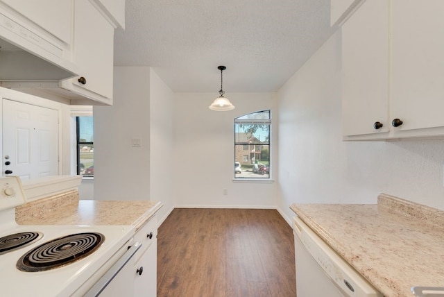 kitchen featuring pendant lighting, stove, white cabinets, white dishwasher, and dark hardwood / wood-style floors