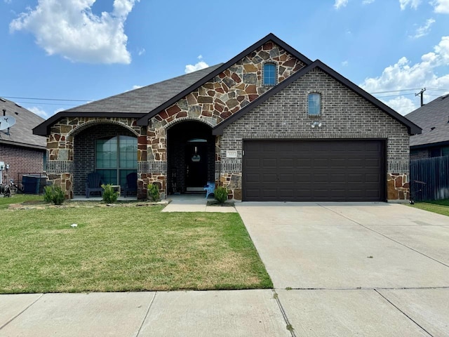 view of front of house featuring central AC, a front lawn, and a garage