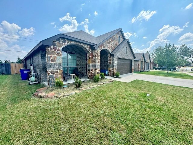 view of front facade with a garage and a front lawn