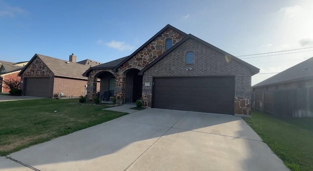 view of front of property with a garage and a front yard