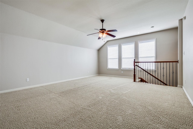 bonus room featuring ceiling fan, carpet floors, and vaulted ceiling