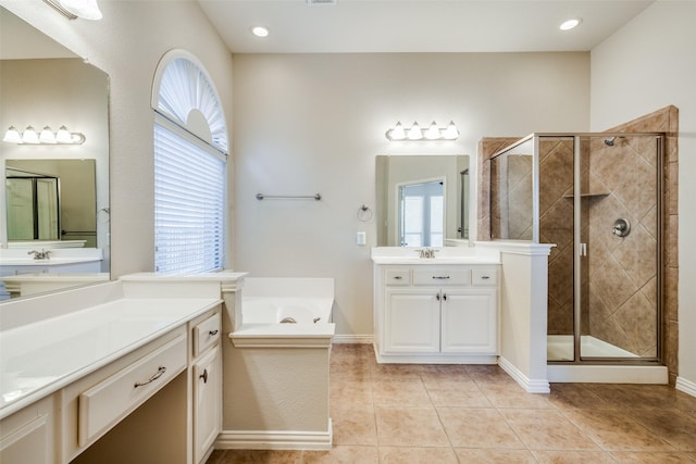 bathroom with tile patterned flooring, vanity, and independent shower and bath