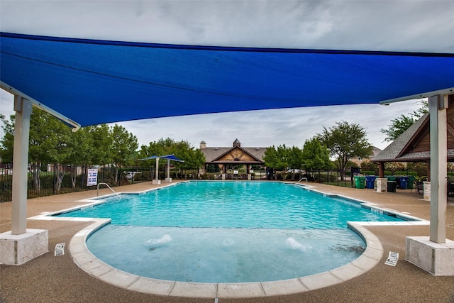 view of swimming pool featuring a patio area