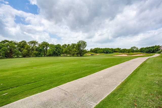 view of property's community featuring a lawn