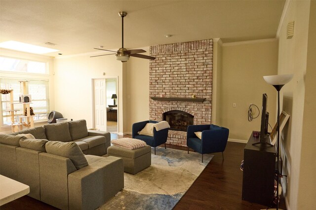 bedroom with light carpet, ensuite bath, a tray ceiling, ceiling fan, and crown molding