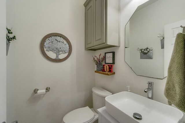 bathroom with toilet and sink