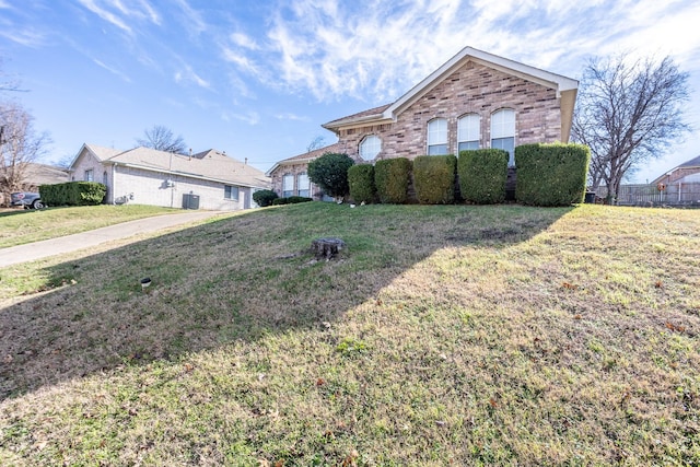 ranch-style home with a front yard