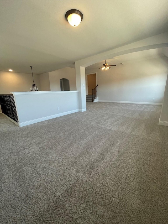 carpeted empty room with ceiling fan