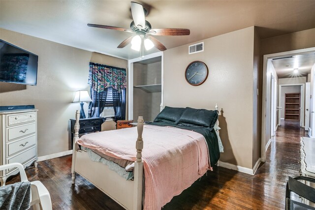 bedroom with ceiling fan and dark hardwood / wood-style floors