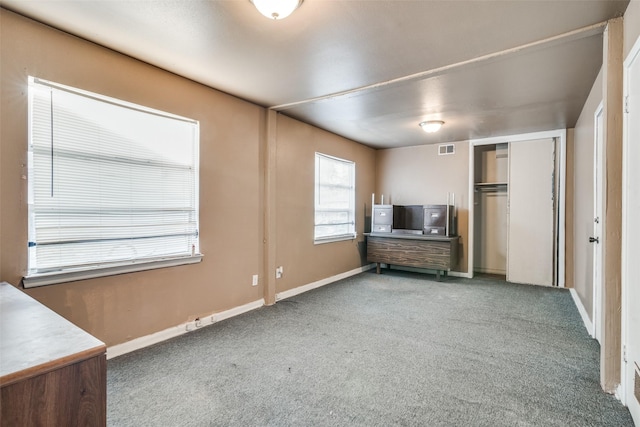 unfurnished bedroom featuring a closet and carpet floors