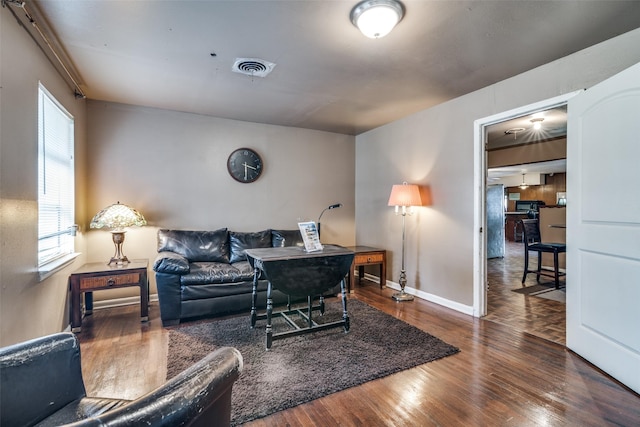 living room with dark hardwood / wood-style flooring