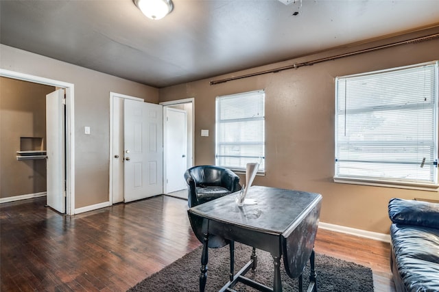 home office featuring dark hardwood / wood-style flooring