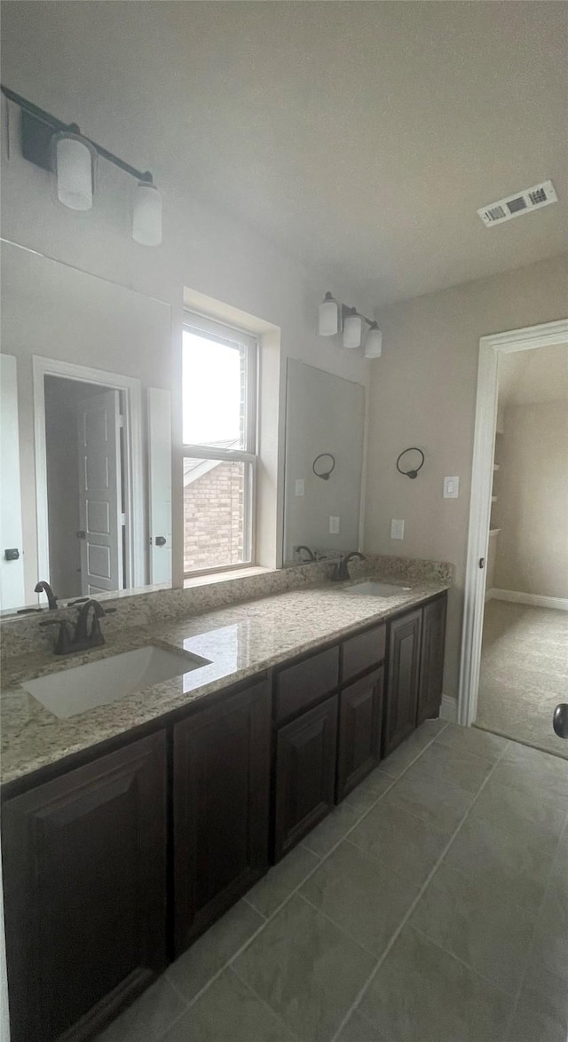 bathroom featuring vanity and tile patterned floors