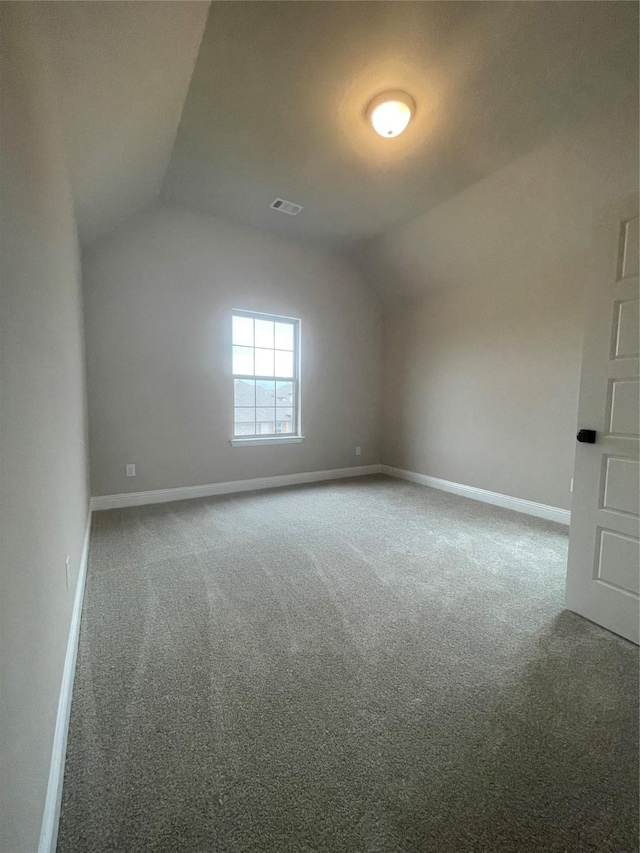 bonus room featuring lofted ceiling and carpet