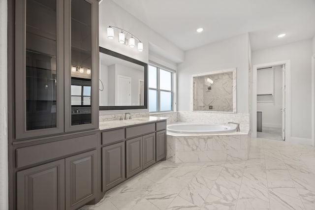 bathroom featuring vanity and plus walk in shower