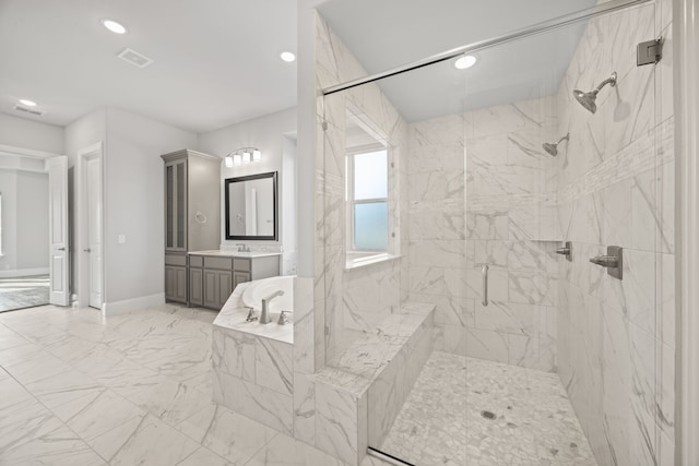 bathroom with vanity and a shower with shower door