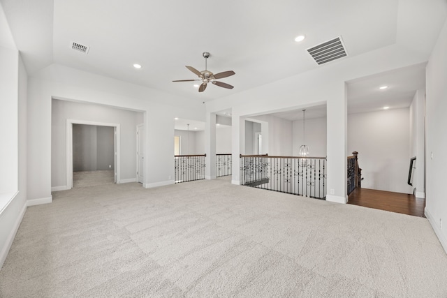 carpeted spare room featuring ceiling fan