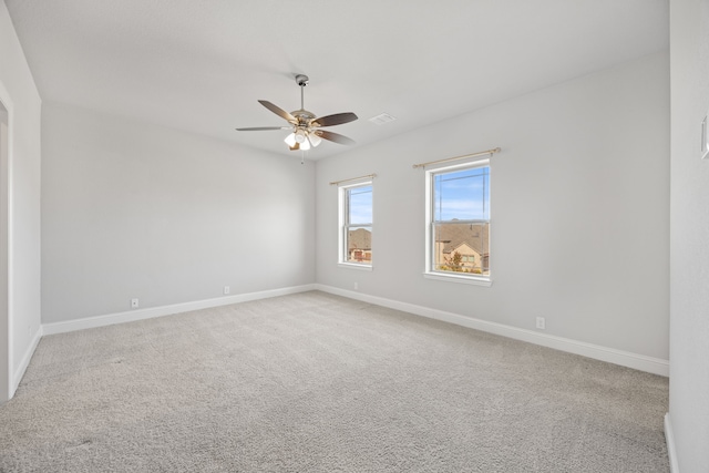 carpeted empty room with ceiling fan