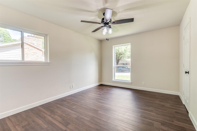 empty room featuring dark hardwood / wood-style floors and ceiling fan