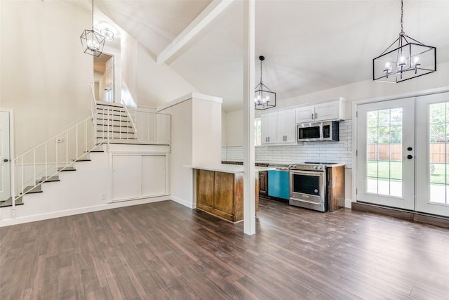 kitchen featuring french doors, stainless steel appliances, dark hardwood / wood-style flooring, high vaulted ceiling, and white cabinets