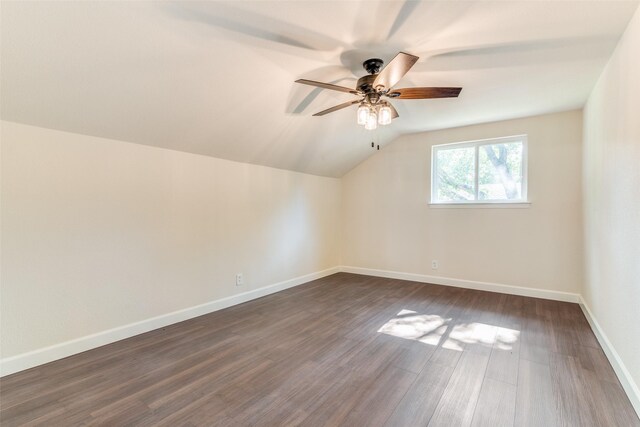 additional living space featuring dark hardwood / wood-style floors, ceiling fan, and lofted ceiling